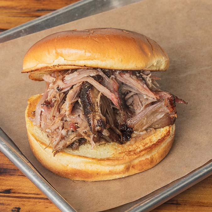 Pulled pork sandwich on a toasted bun from our BBQ Restaurant in Mundelein IL.